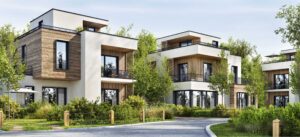 Moderne FÖFA-Wohnanlage mit Holzfassade, großen Fensterfronten, Balkonen und gepflegter Garten- und Außenanlage